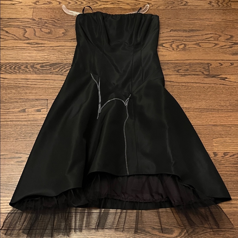NICOLE MILLER Elegant Black Dress with chain Detailing.